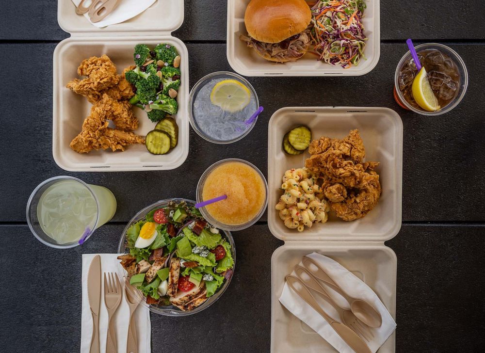 Food and drinks in serveware made with Aventa, including fried chicken, salads, sandwiches and frozen drinks.  