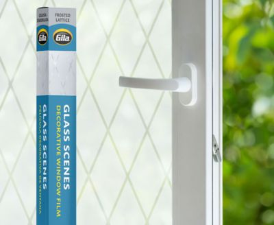 Retail packaging displayed next to a window treated with the Frosted Lattice decorative film.