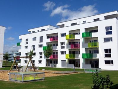 white building with colorful balconies