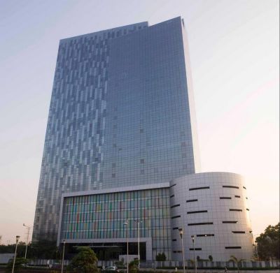 Tall building with colorful facade piece