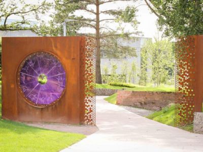 wall with a round purple window in the park