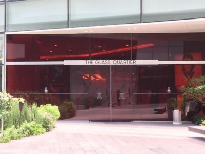 red colored glass facade of the shopping mall