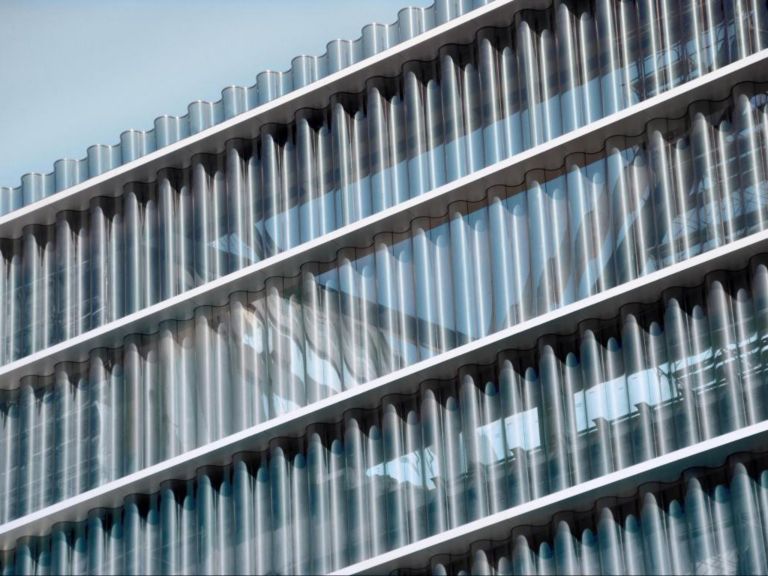 grey glass tubes facade 