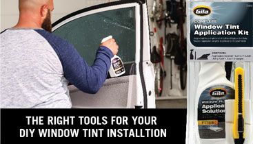 Gila® automotive window tint applications tools being used on vehicle window