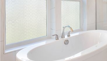 Interior view of bathroom windows changed with decorative film
