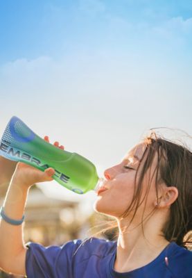 Girl drinking from water bottle