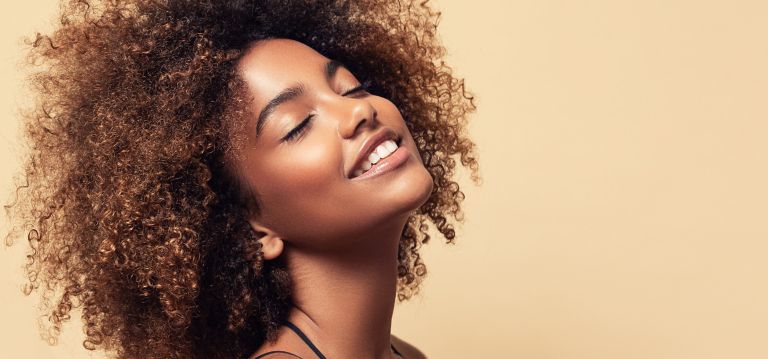 Glamour portrait of a person with curly hair. 