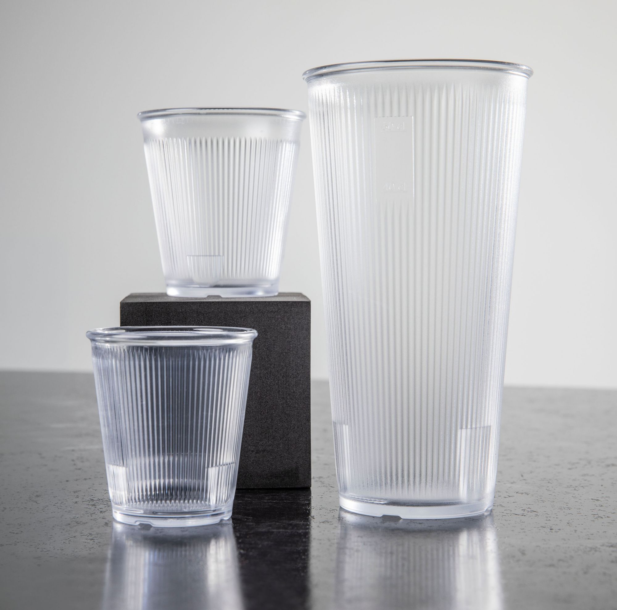 Three pieces of drinkware in various sizes made with Tritan copolyester.  