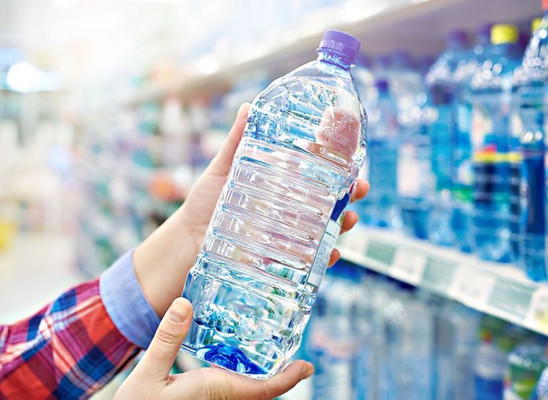 Grabbing a bottle of water. 