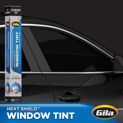 Gila Heat Shield 20% VLT Window Tint packaging in front of car