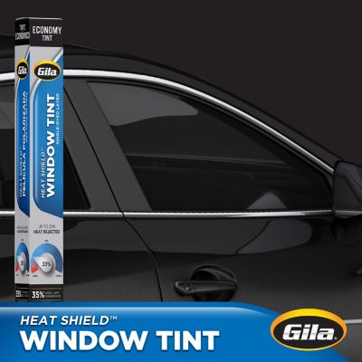 Gila® Heat Shield 35% VLT Window Tint packaging in front of car