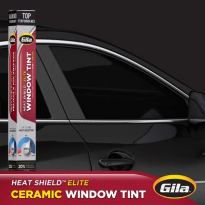 Gila® Heat Shield Elite 20% VLT Window Tint packaging in front of car