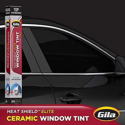 Gila® Heat Shield Elite 20% VLT Window Tint packaging in front of car