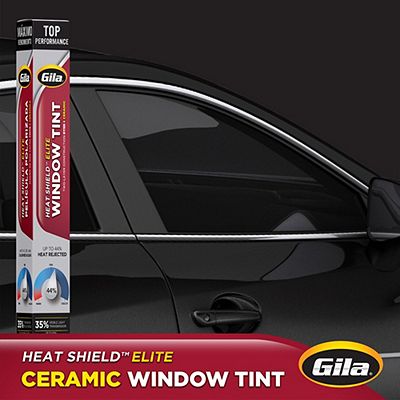 Gila® Heat Shield Elite 35% VLT Window Tint packaging in front of car