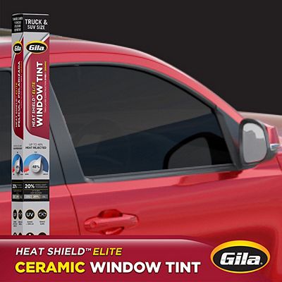 Gila® Heat Shield Elite 20% VLT Truck & SUV Window Tint packaging in front of car