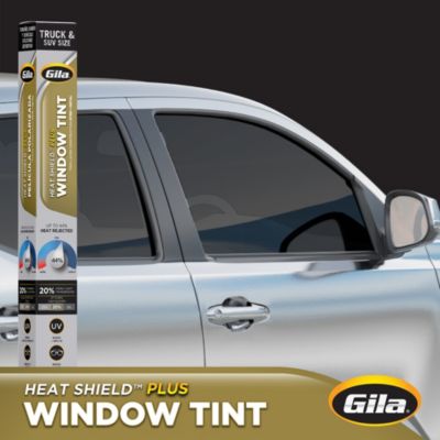 Gila® Heat Shield Plus 20% VLT Truck & SUV Window Tint packaging in front of car