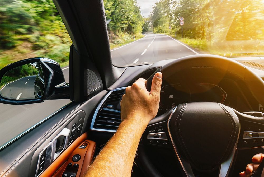 A person’s point of view from driving inside an electric vehicle.  