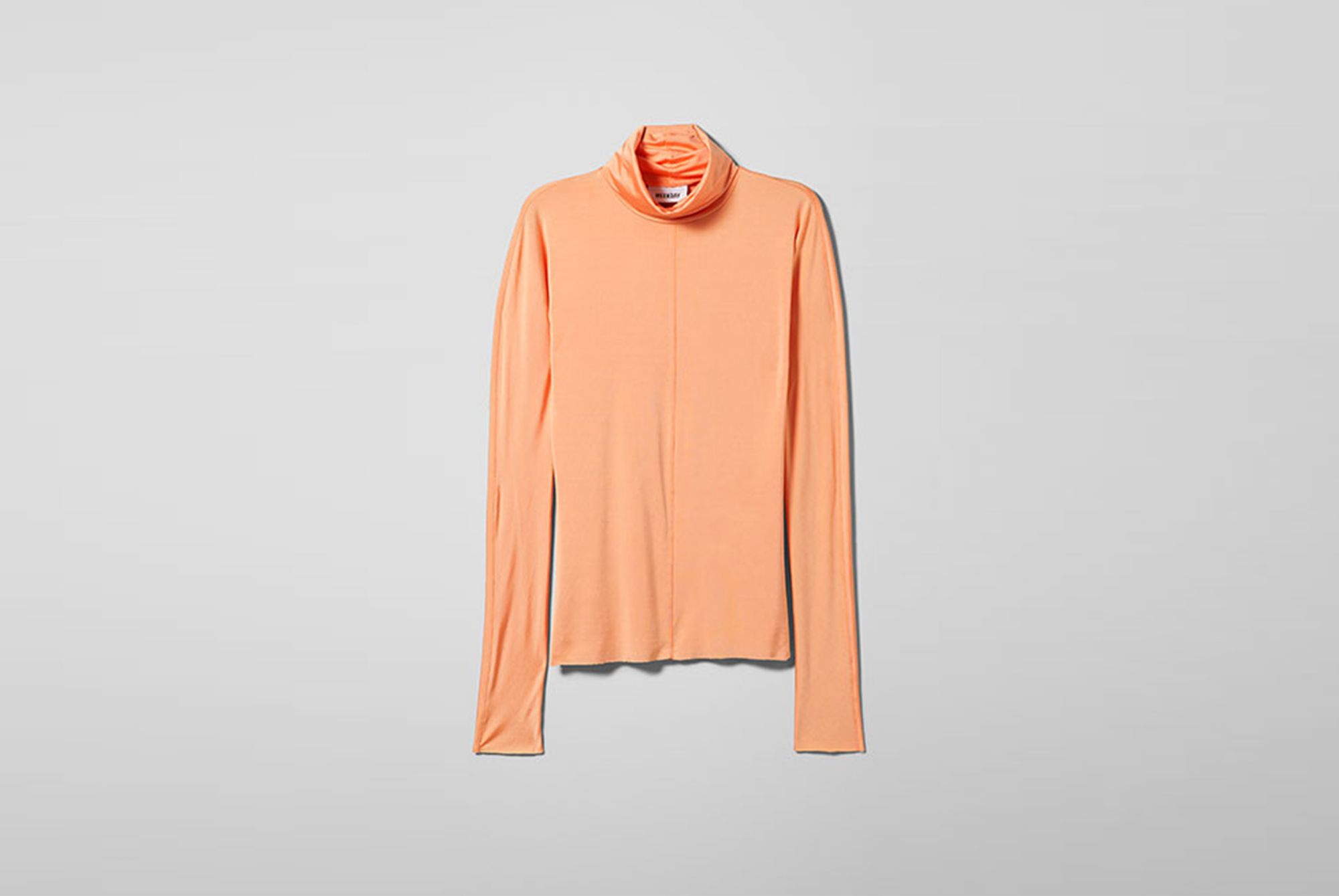 Isolated long-sleeved turtleneck orange shirt Weekday made with 100% Naia™ 