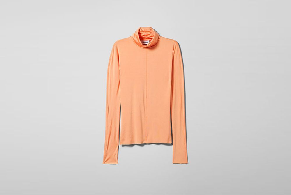 Isolated long-sleeved turtleneck orange shirt Weekday made with 100% Naia™ 