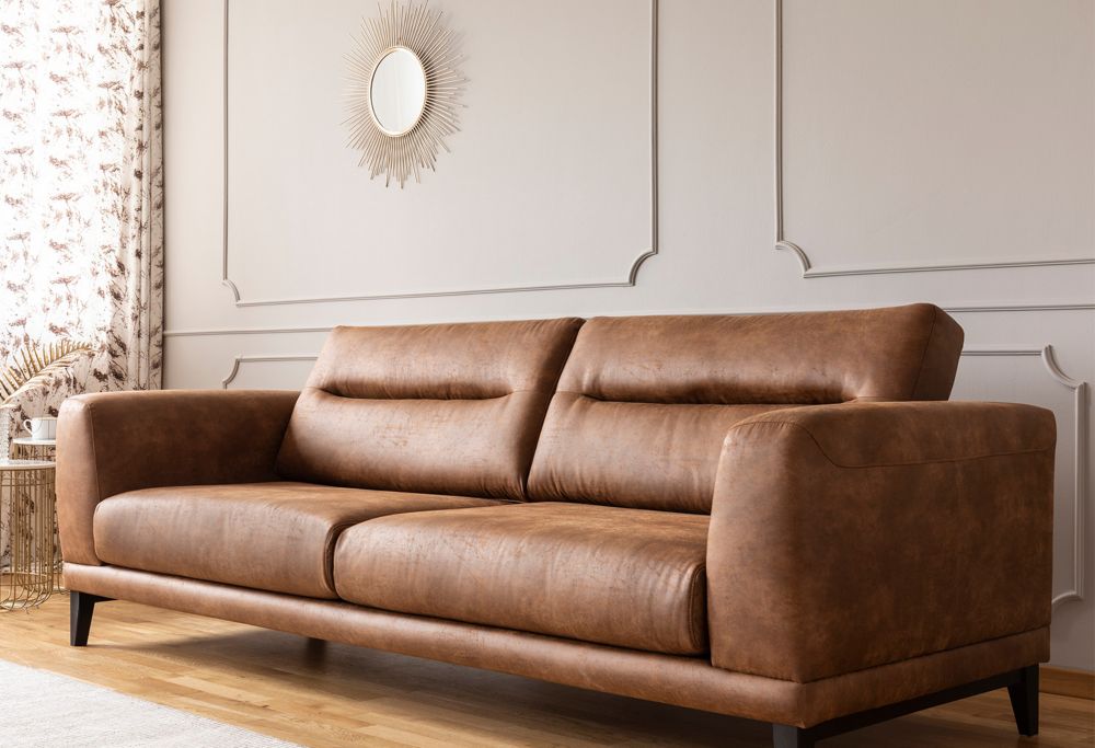A leather couch in a living room. 