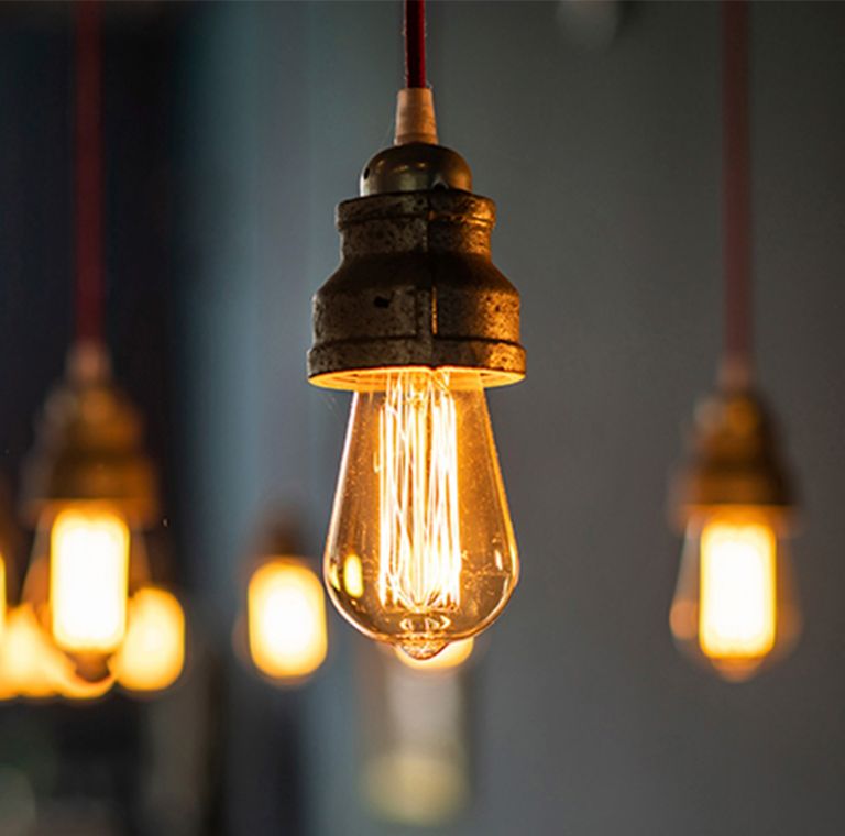 Edison-style lights hang from the ceiling. 