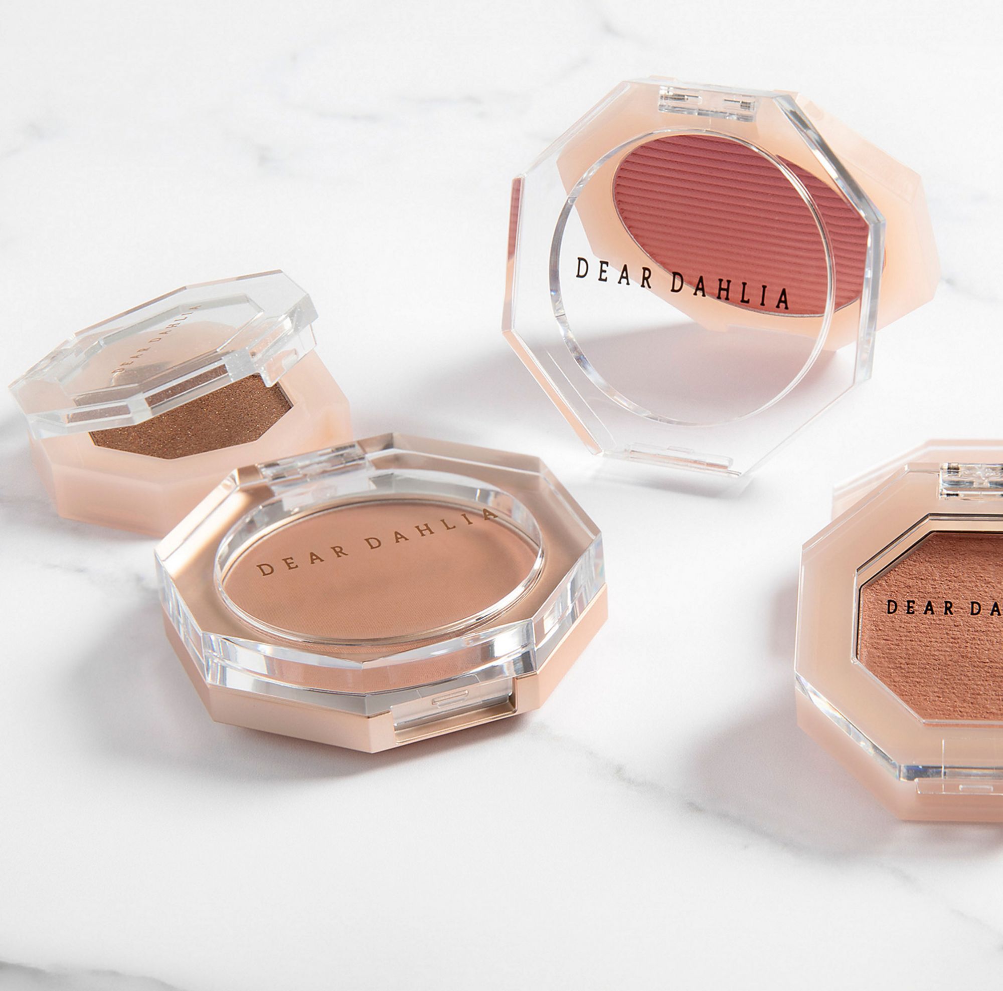 Four Dear Dhalia bronzer and blush compacts made from Eastman Cristal Renew. 