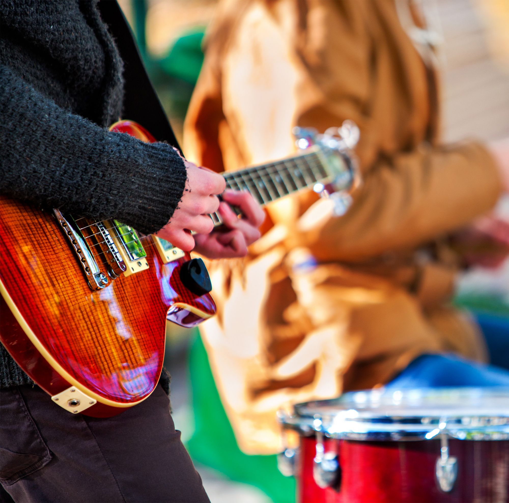Musicians playing guitar and drums 