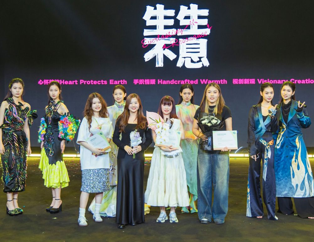 Four Beijing student designers pose with models wearing the garments they created with Naia-blended fabrics. 