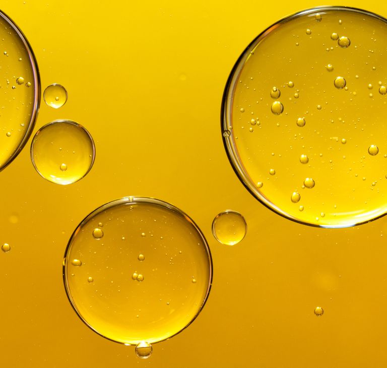 Close-up of yellow oil droplets. 