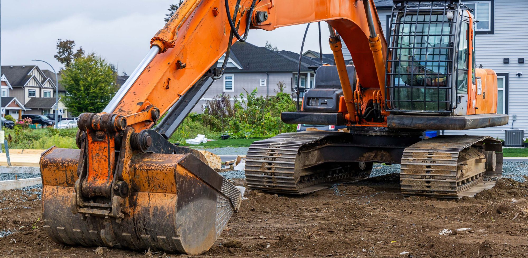An excavator is at rest at a construction site.  