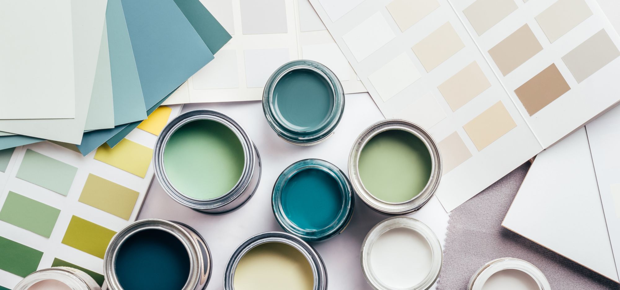 Color swatches and paint samples on a table. 