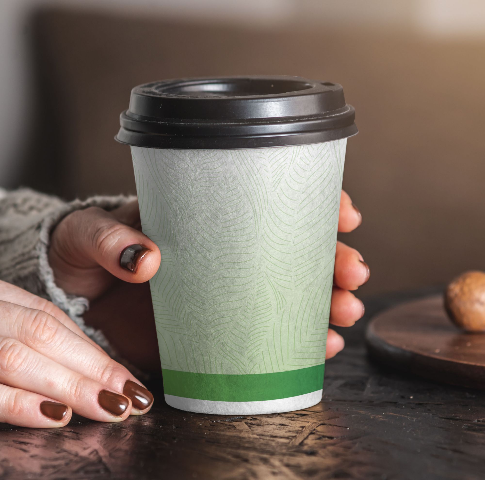A disposable cup with a paper coating that features biobased Eastman Solus.  