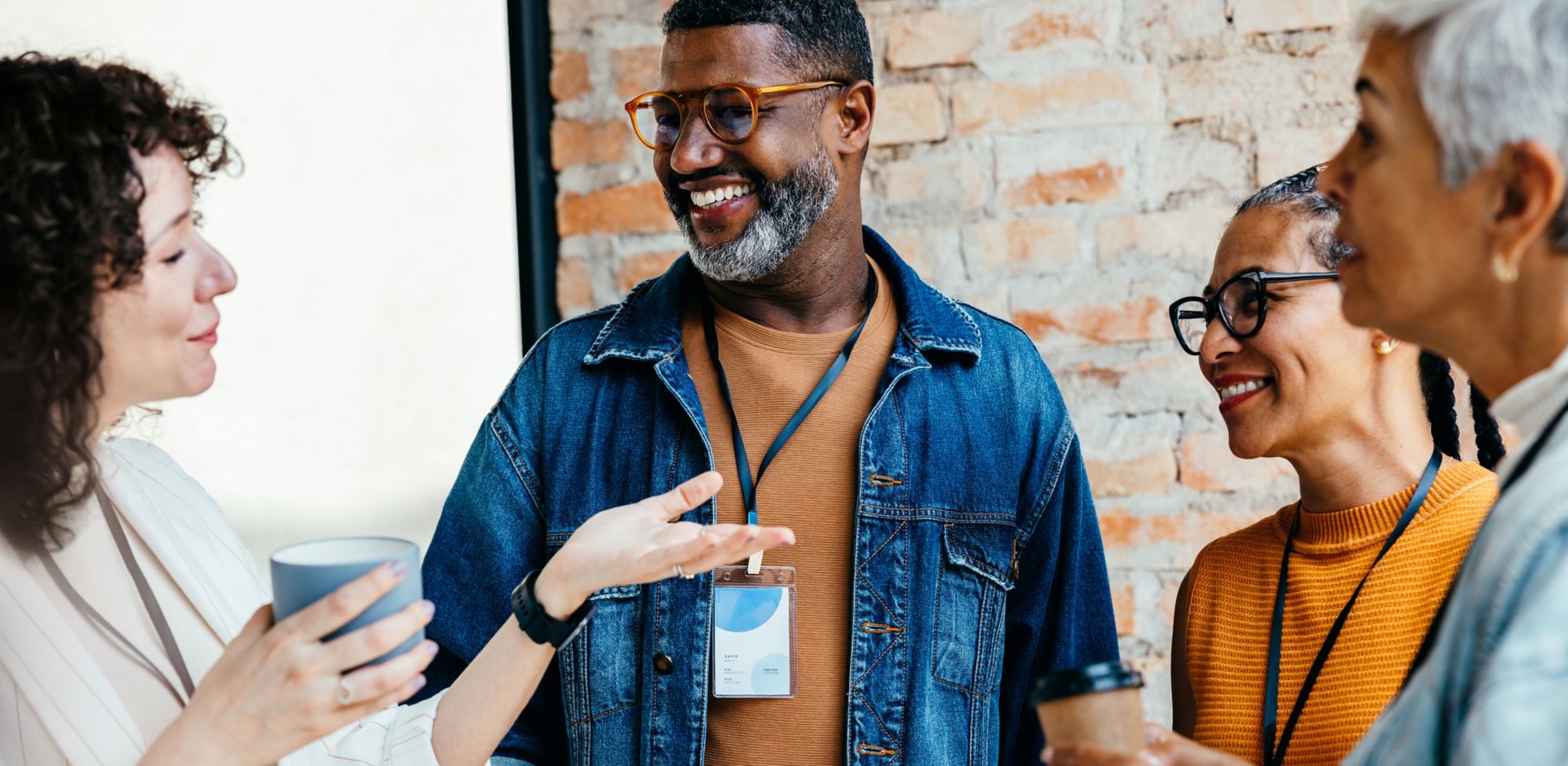 People gathering around in conversation. 