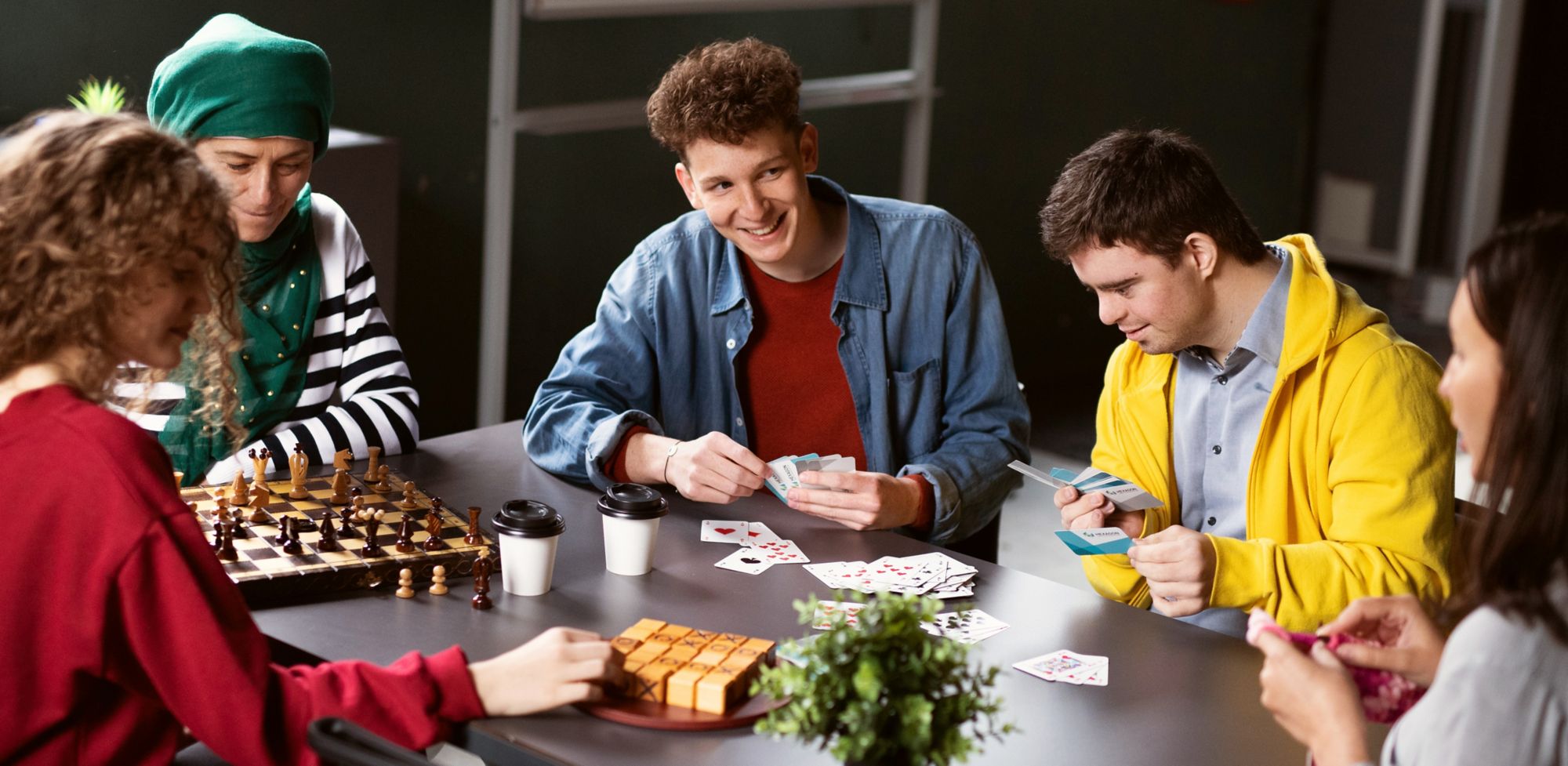 People playing various card games. 