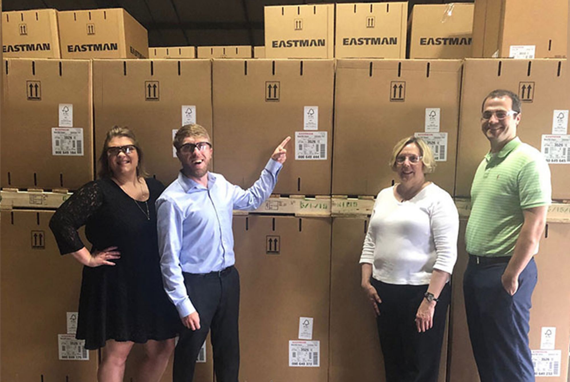 Eastman team next to first shipments of FSC Mix-certified Naia™ cellulosic yarn: Ben Holmes, Karen Kiel, Andy Myers and Brittany Richardson-Holt 