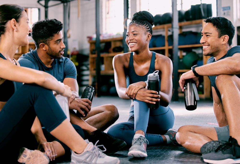 People sitting in the gym. 