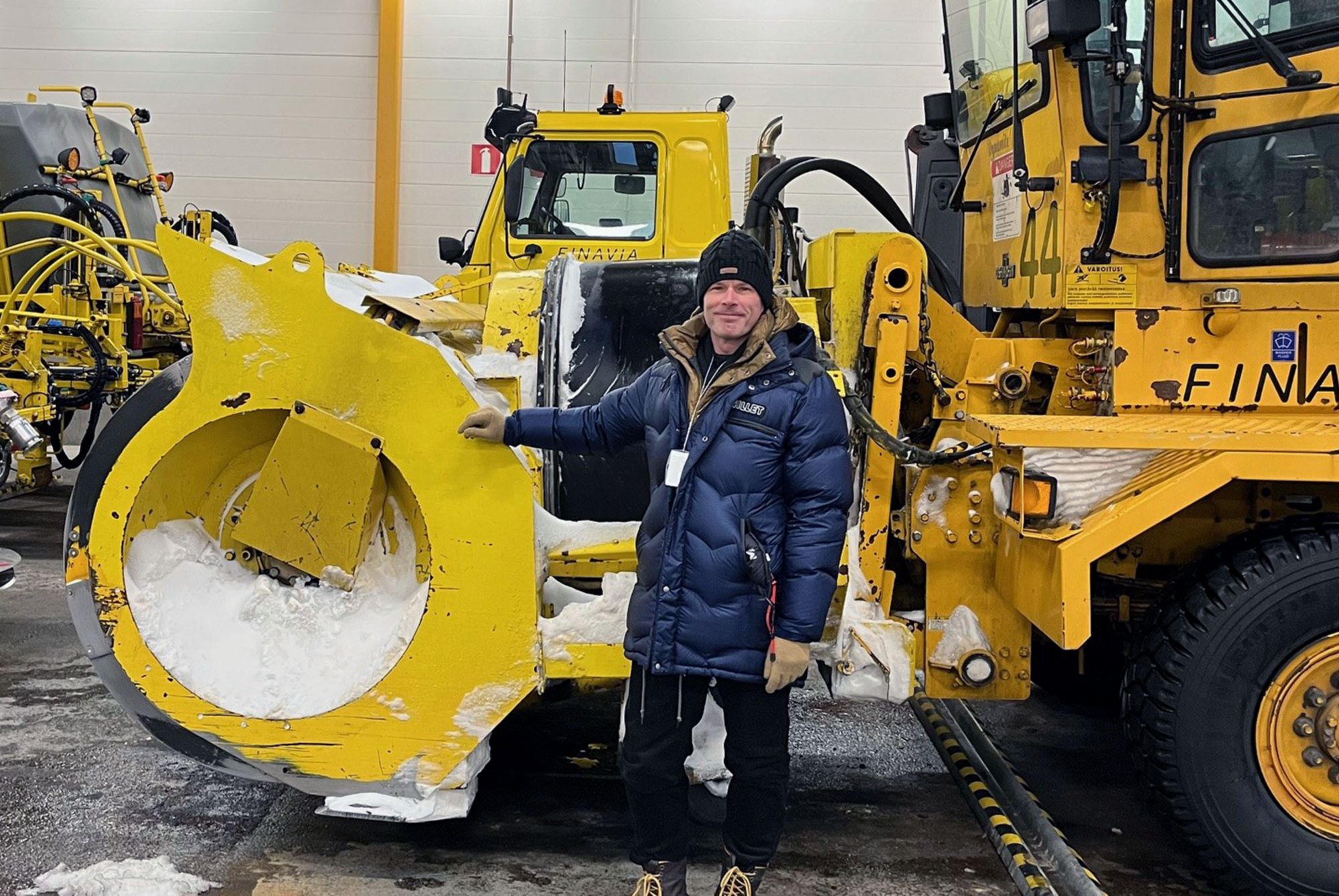 Eastman sales manager Wouter Reyntjens poses with a Finavia snow plow 