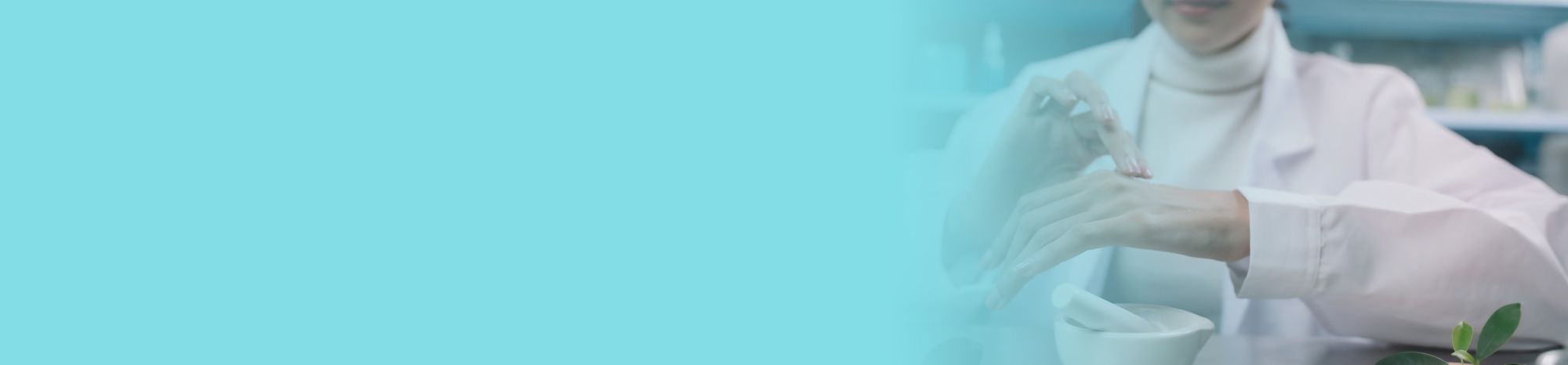 A person rubs a skin care product onto the back of their hand.   