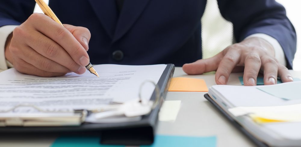 Policy making corporate team signing papers 