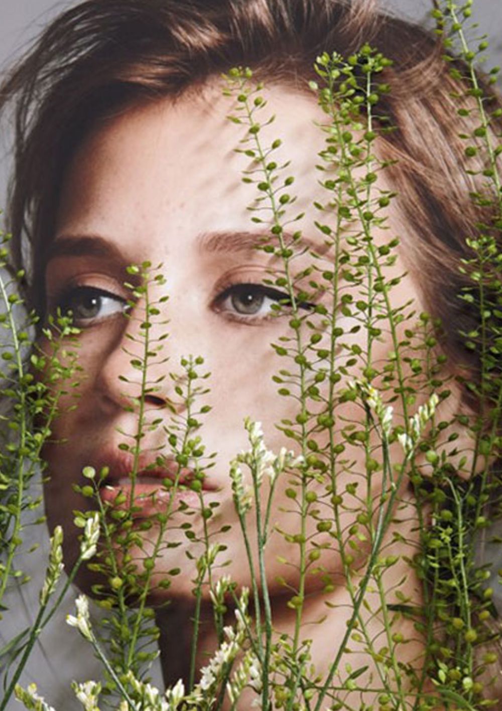 Portrait person covered greenery 