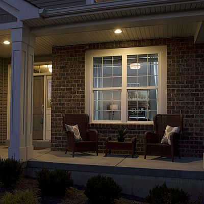 Nighttime view of Gila® Privacy Control Mirror Window Film outside of home