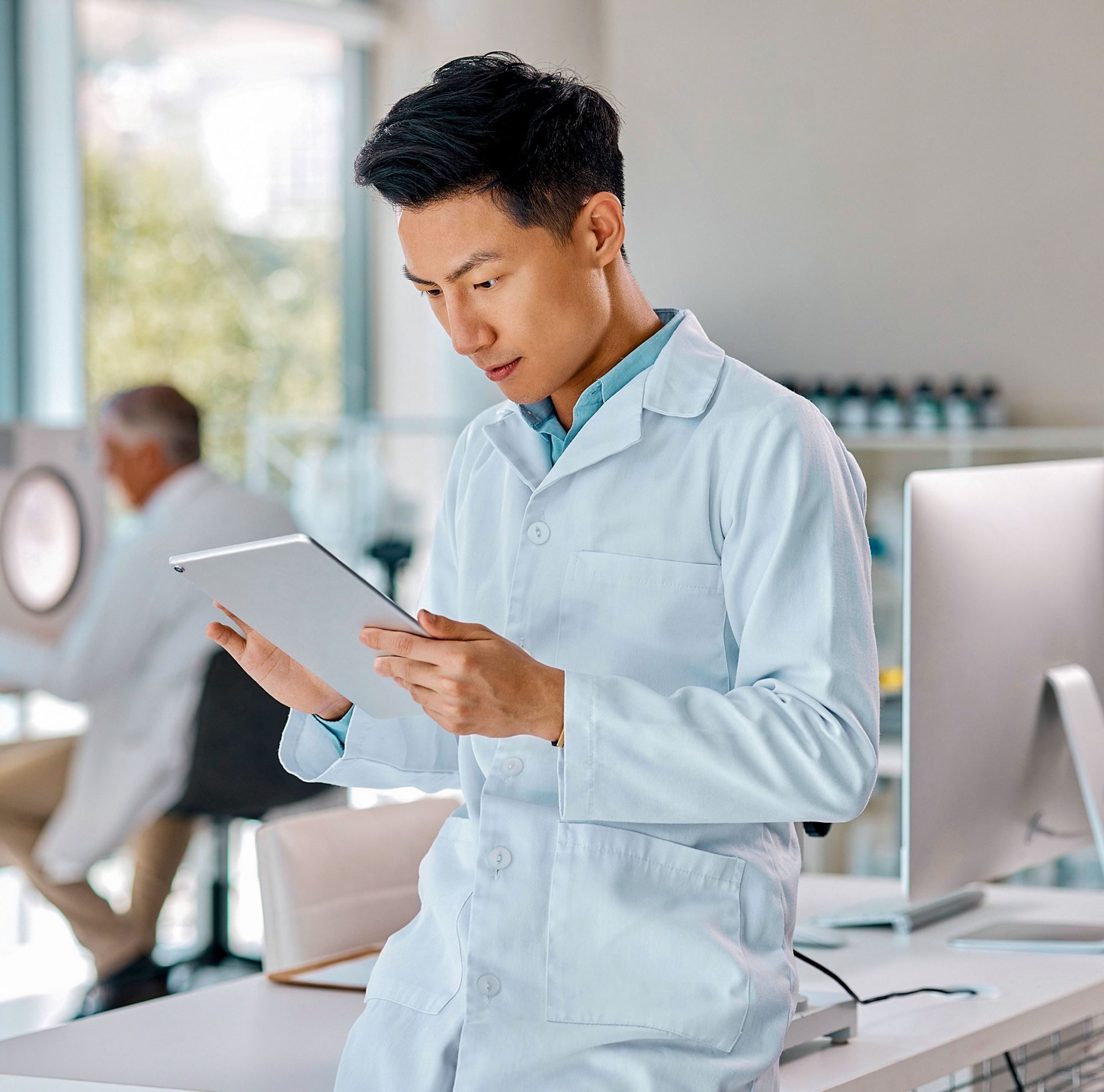 A scientist using their digital tablet. 