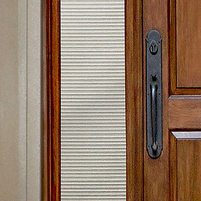 Close up of Gila® Faux Shades Sidelight Decorative Window Film on front door