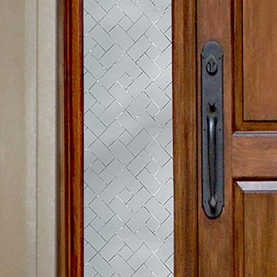 Close up of Gila® Frosted Tiles Sidelight Decorative Window Film on front door