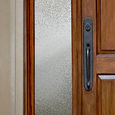 Close up of Gila® Ice Chips Sidelight Decorative Window Film on front door