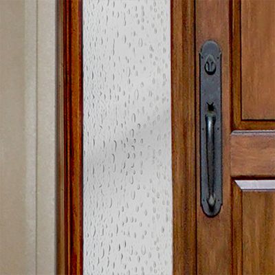 Close up of Gila® Raindrops Sidelight Decorative Window Film on front door