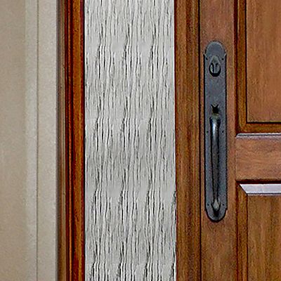Close up of Gila® Waterfall Sidelight Decorative Window Film on front door
