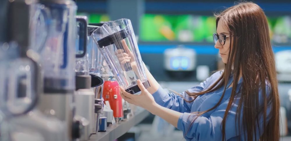 Women looking at plastic kitchenware