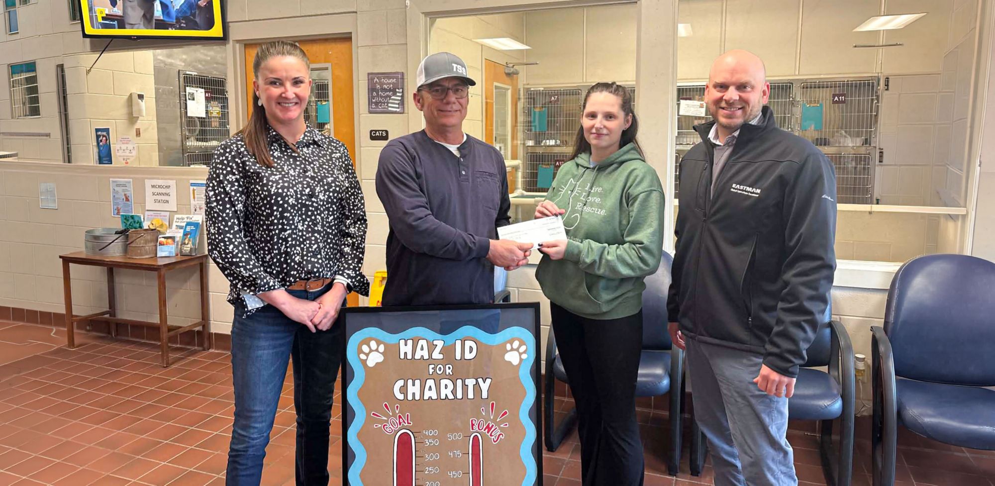 Four people gather for a Pace Operations donation to the Santa Rosa County animal shelter.  