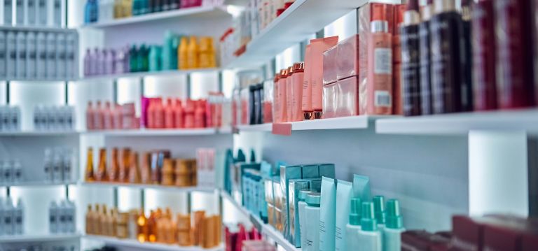 A store shelf of cosmetics products. 